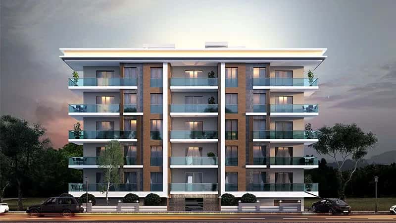 Akşam saatlerinde aydınlatılmış balkonlarıyla modern bir apartman binası görseli