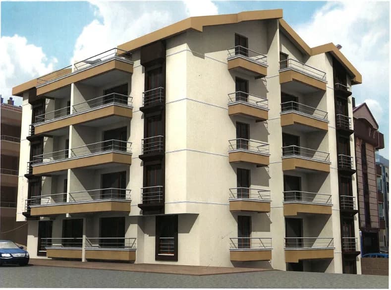 Köşe parselde konumlanan, balkonlu beş katlı apartman binasının görseli